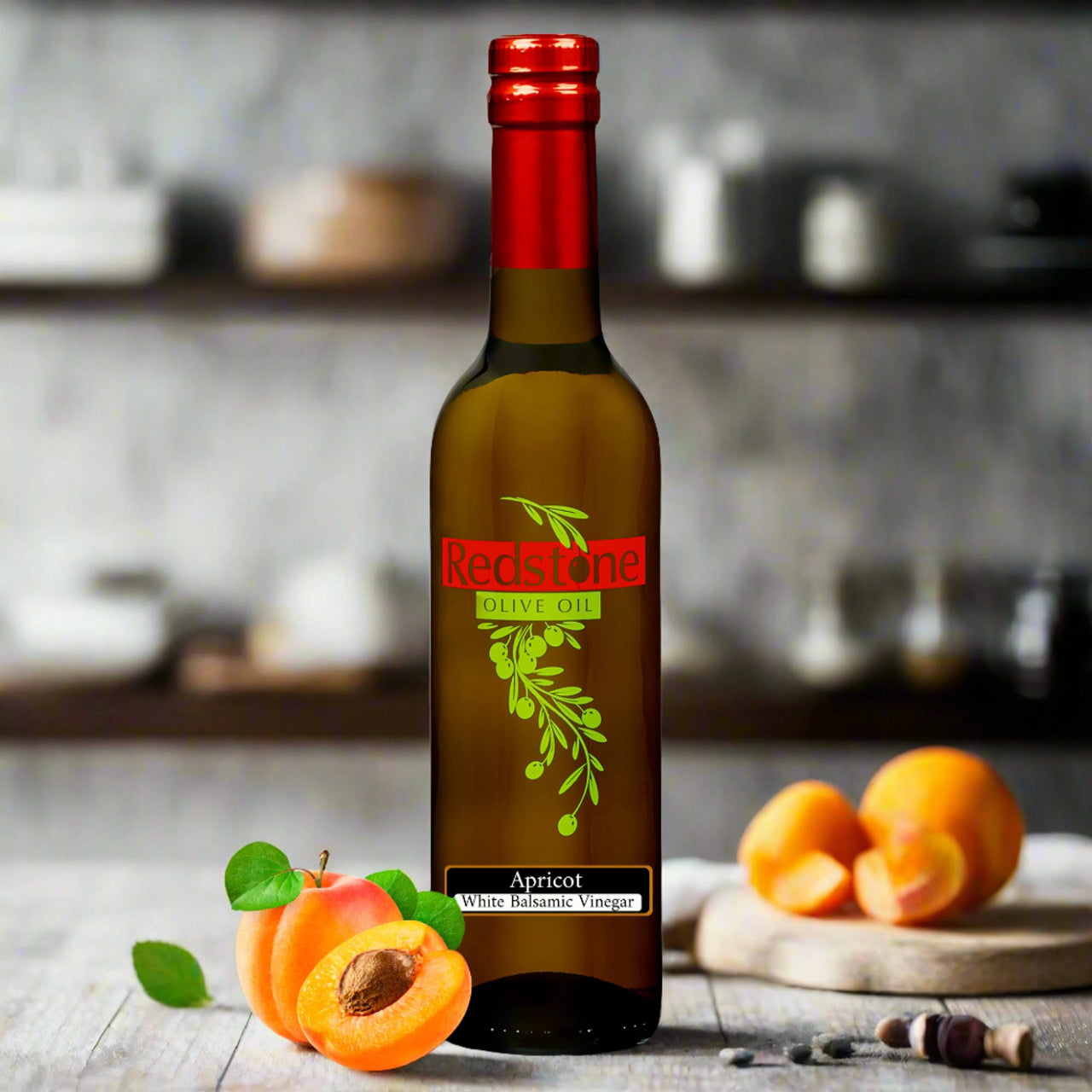 Apricot White Balsamic Vinegar bottle surrounded by whole apricots on a wooden table