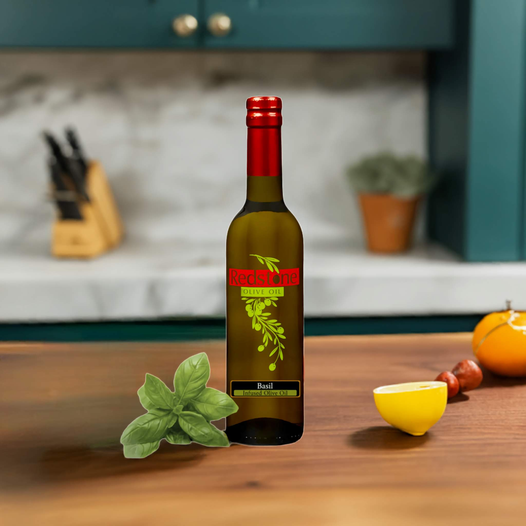 Basil Infused Olive Oil on a kitchen counter with tomatoes and fresh herbs