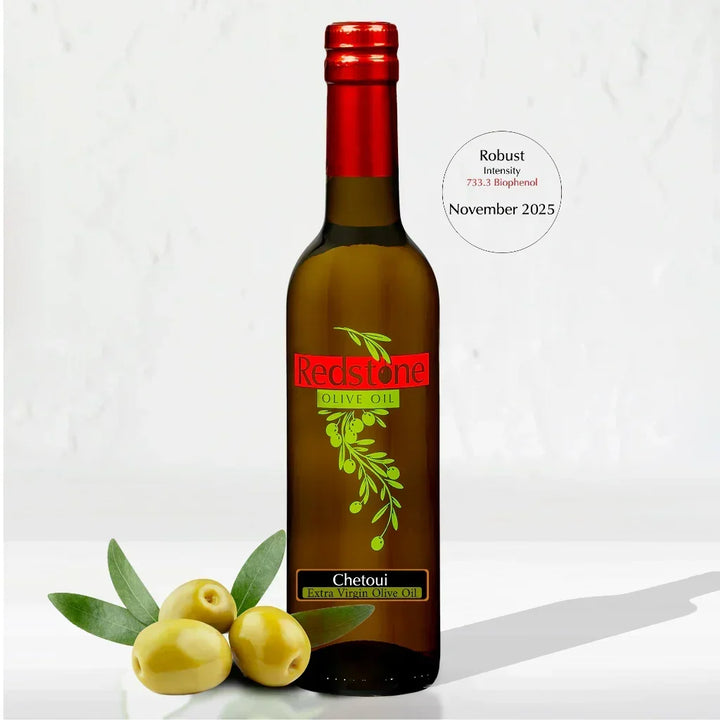 Chetoui extra virgin olive oil bottle with olives, robust intensity, November 2025 label.