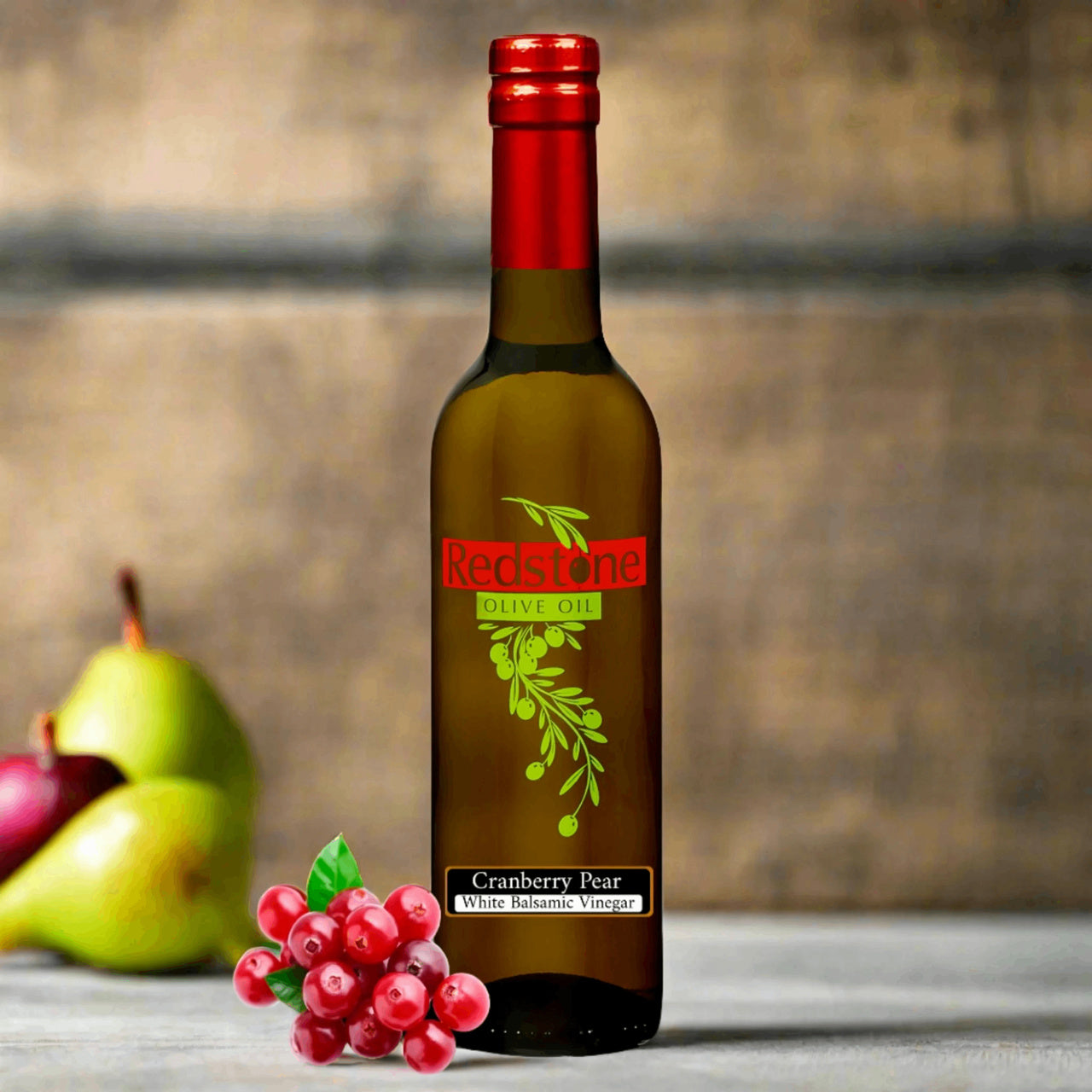 Cranberry Pear White Balsamic Vinegar bottle accompanied by cranberries and a pear
