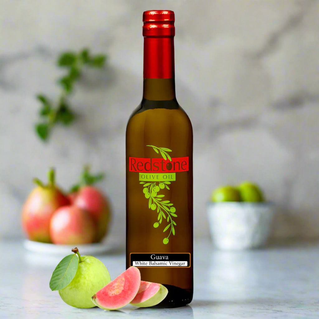 Guava White Balsamic Vinegar in bottle with fruit in the Kitchen counter