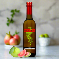 Thumbnail for Guava White Balsamic Vinegar in bottle with fruit in the Kitchen counter