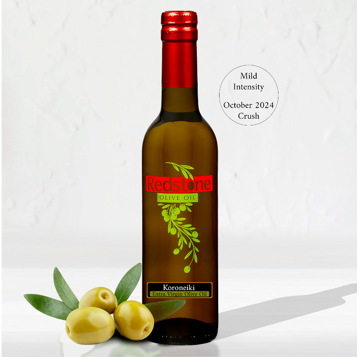 Bottle of Koroneiki Mild Extra Virgin Olive Oil with olives