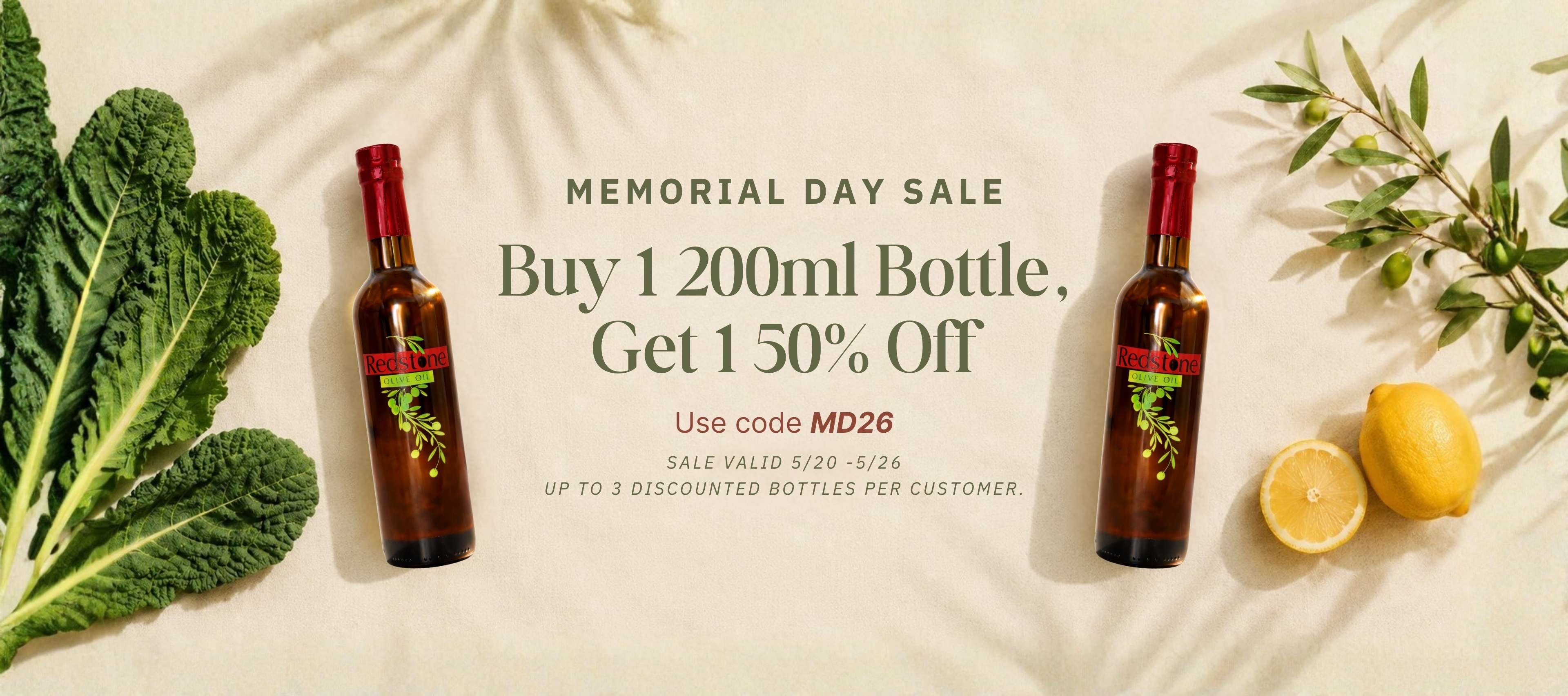 Memorial Day sale advertisement with two bottles of wine, lemons, and greens on a light background.