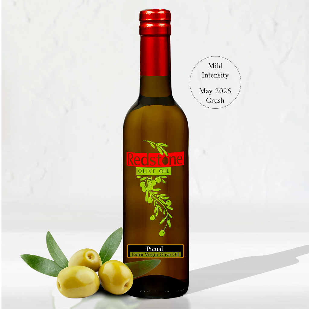 Picual Extra Virgin Olive Oil bottle with fresh olives