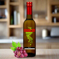 Thumbnail for Close-up of Rose White Balsamic Vinegar bottle in kitchen with red grapes in the background