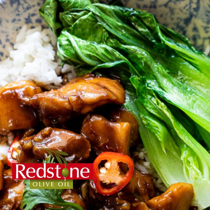 Bowl of chicken and vegetable dish with Redstone Olive Oil branding