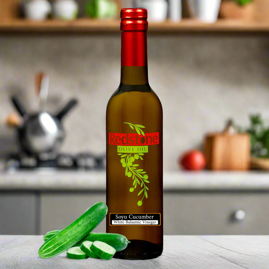 Close-up of cucumber White Balsamic Vinegar bottle in kitchen with cucumbers in the 