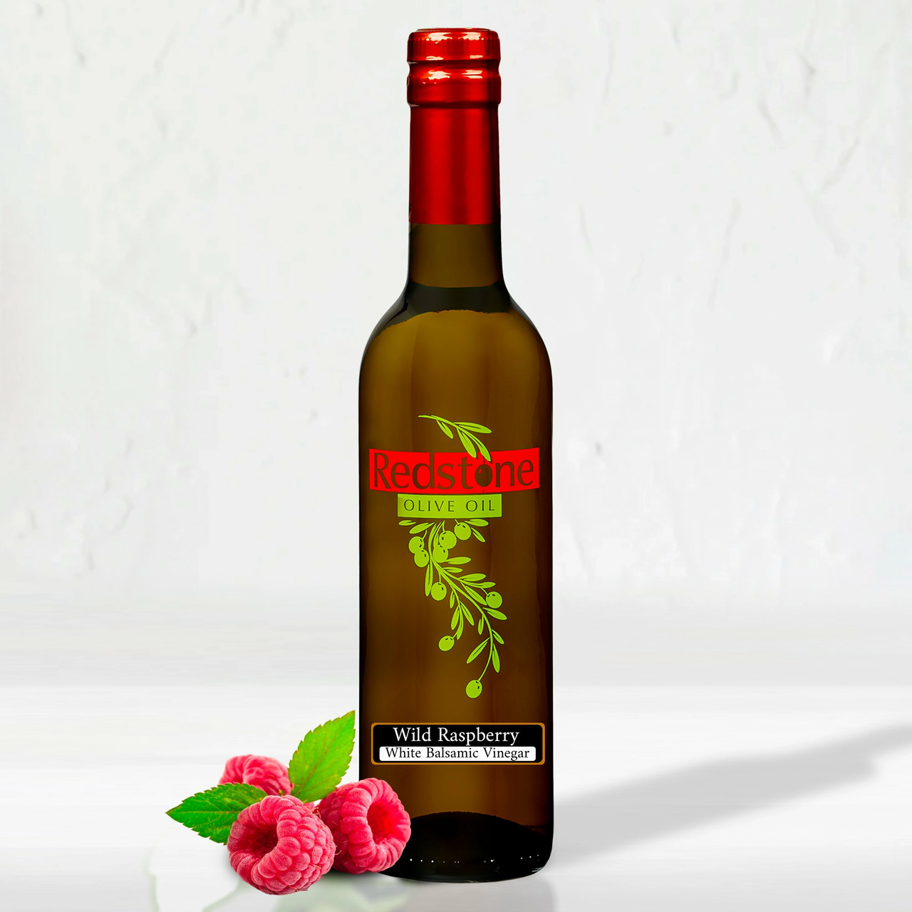 Cascadian Wild Raspberry White Balsamic Vinegar bottle with fresh raspberries