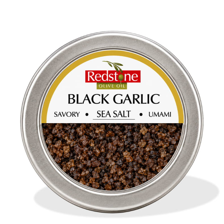 Redstone Black Garlic Sea Salt front tin label — Savory · Sea Salt · Umami — all natural, no preservatives