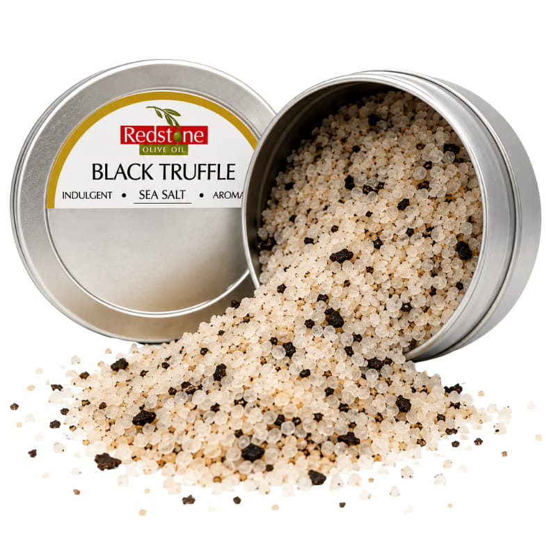 Redstone Black Truffle Sea Salt open tin spilling salt with black truffle pieces — gourmet finishing salt