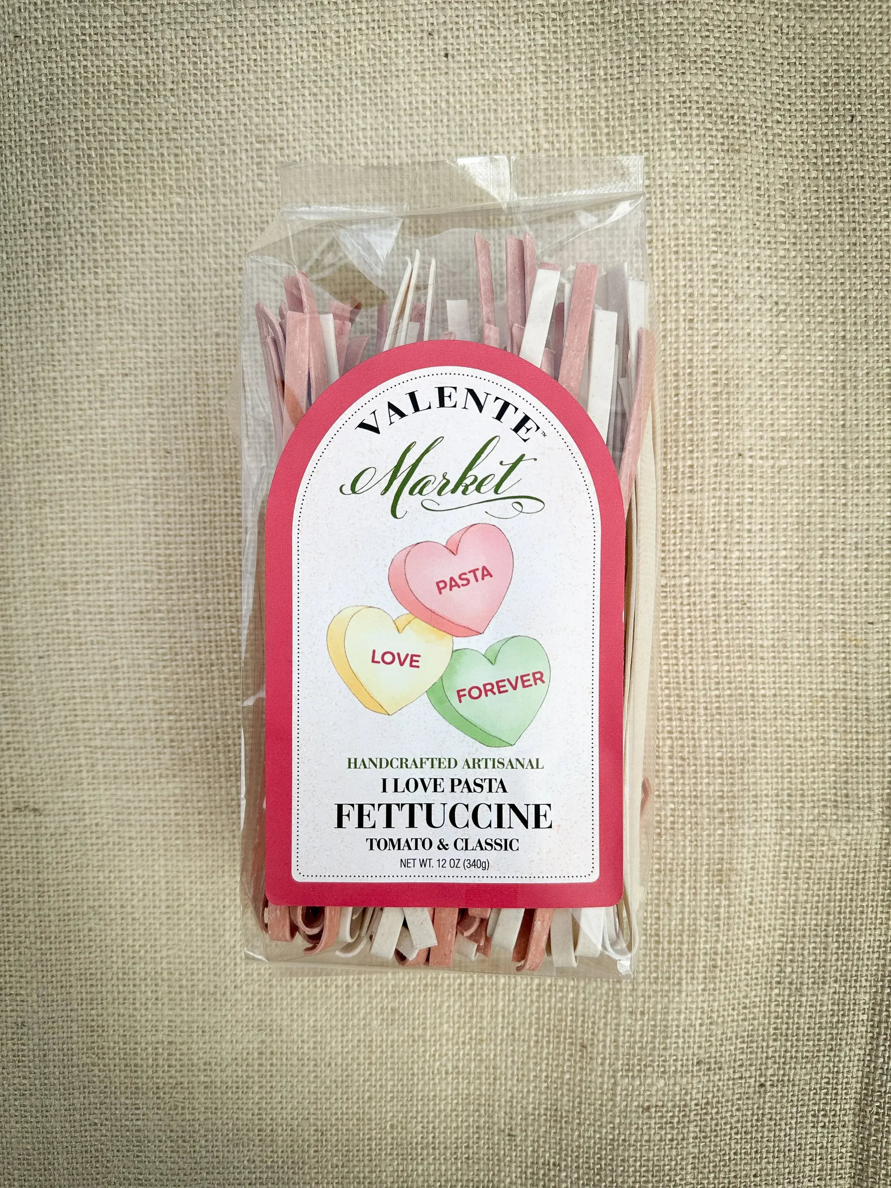 I Love Pasta white and red fettuccine in clear packaging — naturally tinted with tomato and beet powder, artisan small-batch pasta made in USA