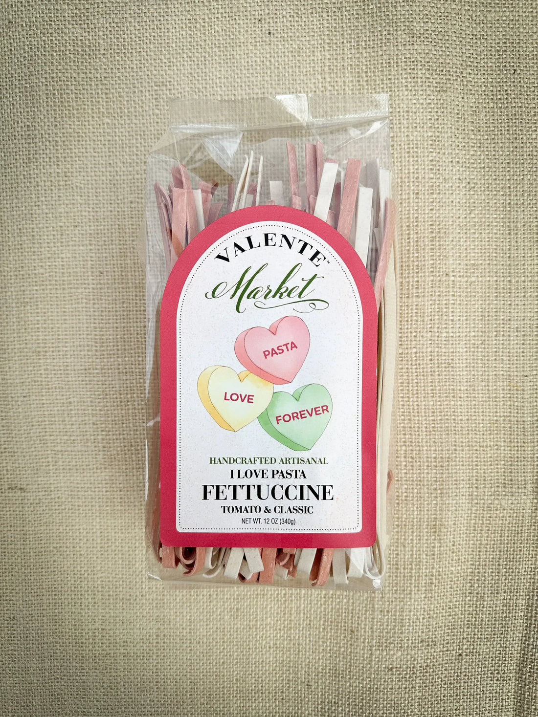 I Love Pasta white and red fettuccine in clear packaging — naturally tinted with tomato and beet powder, artisan small-batch pasta made in USA