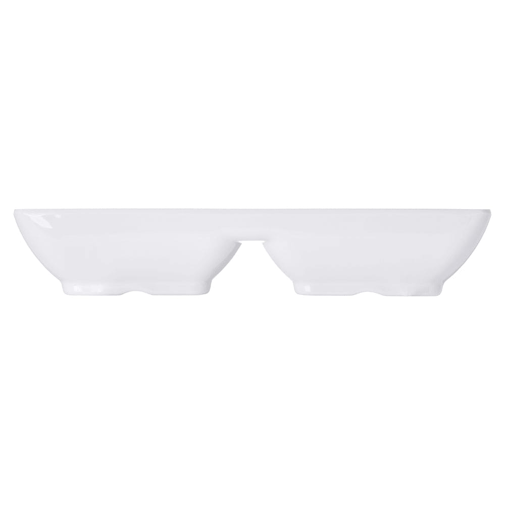 Side profile of white divided dipping dish showing its low, footed base