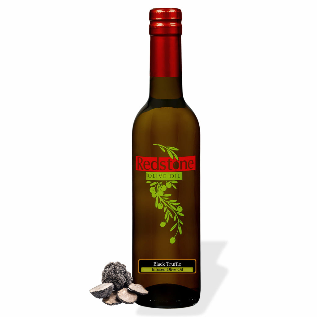 Bottle of Redstone Black Truffle Infused Olive Oil with whole black truffles