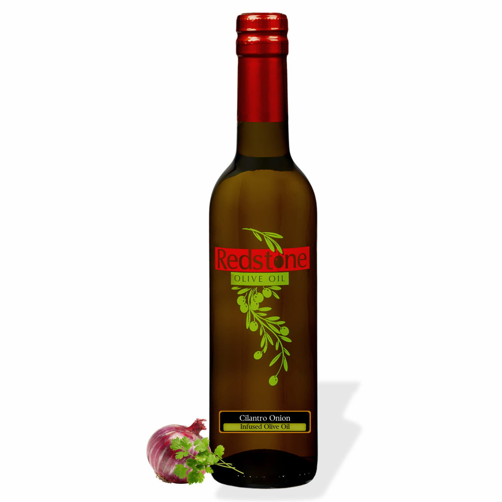 Bottle of Redstone Cilantro Onion Infused Olive Oil with fresh cilantro and red onion