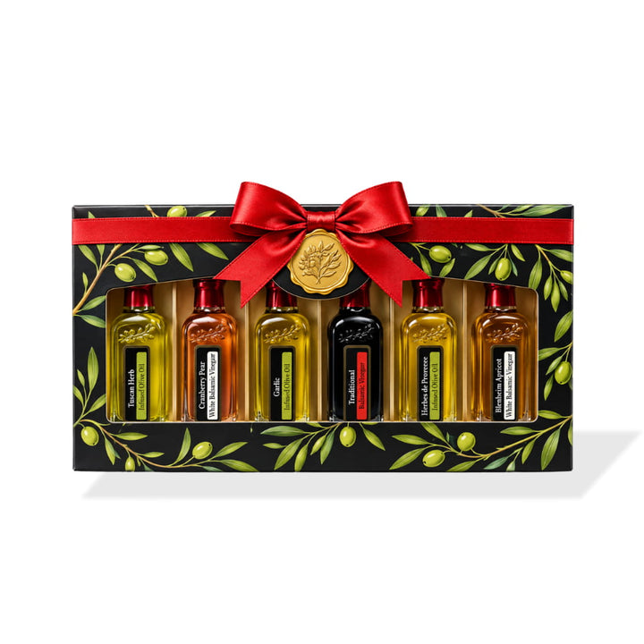 Six Redstone olive oil and balsamic sampler bottles in a black olive-branch gift box with red bow and gold seal