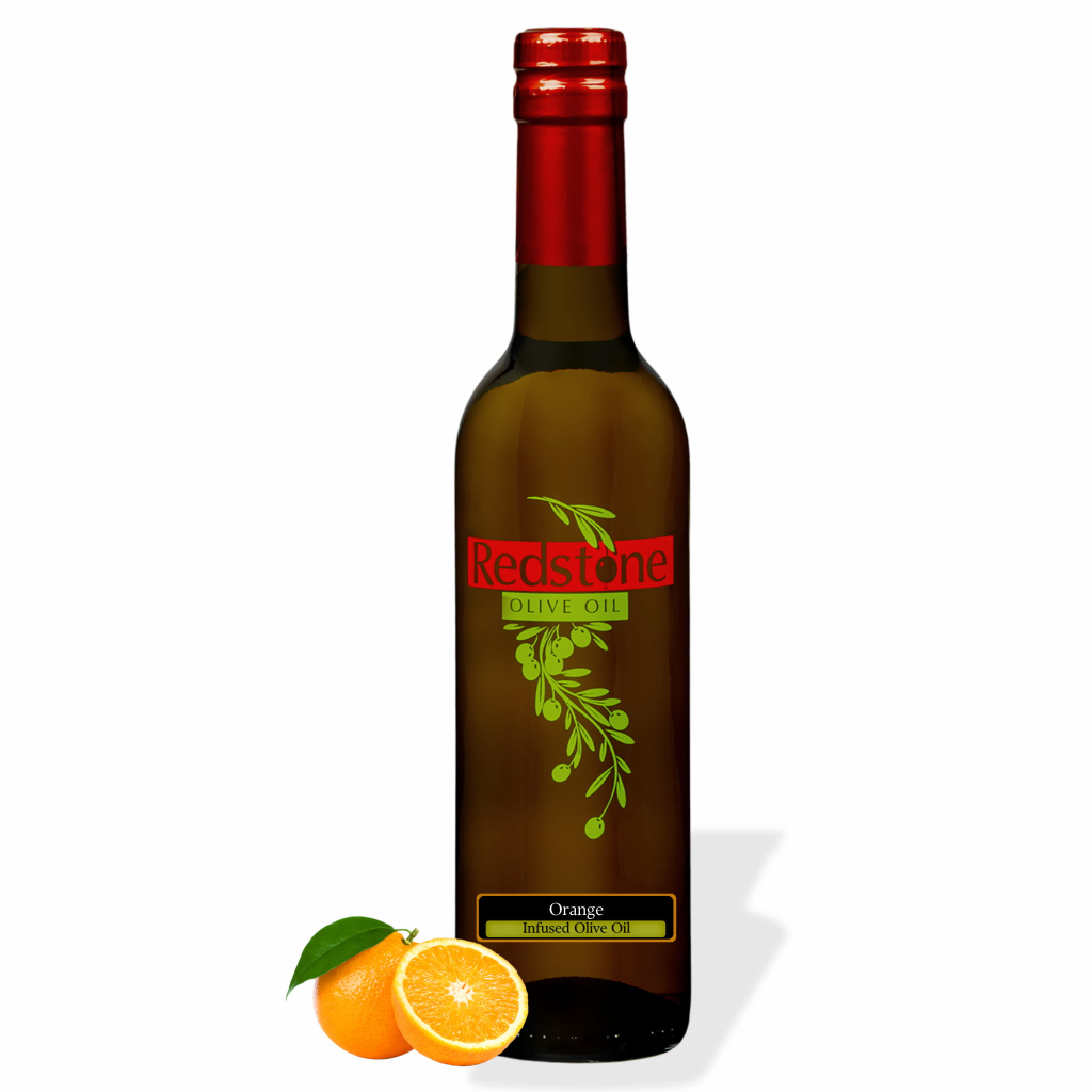 Bottle of Redstone orange infused olive oil with fresh oranges