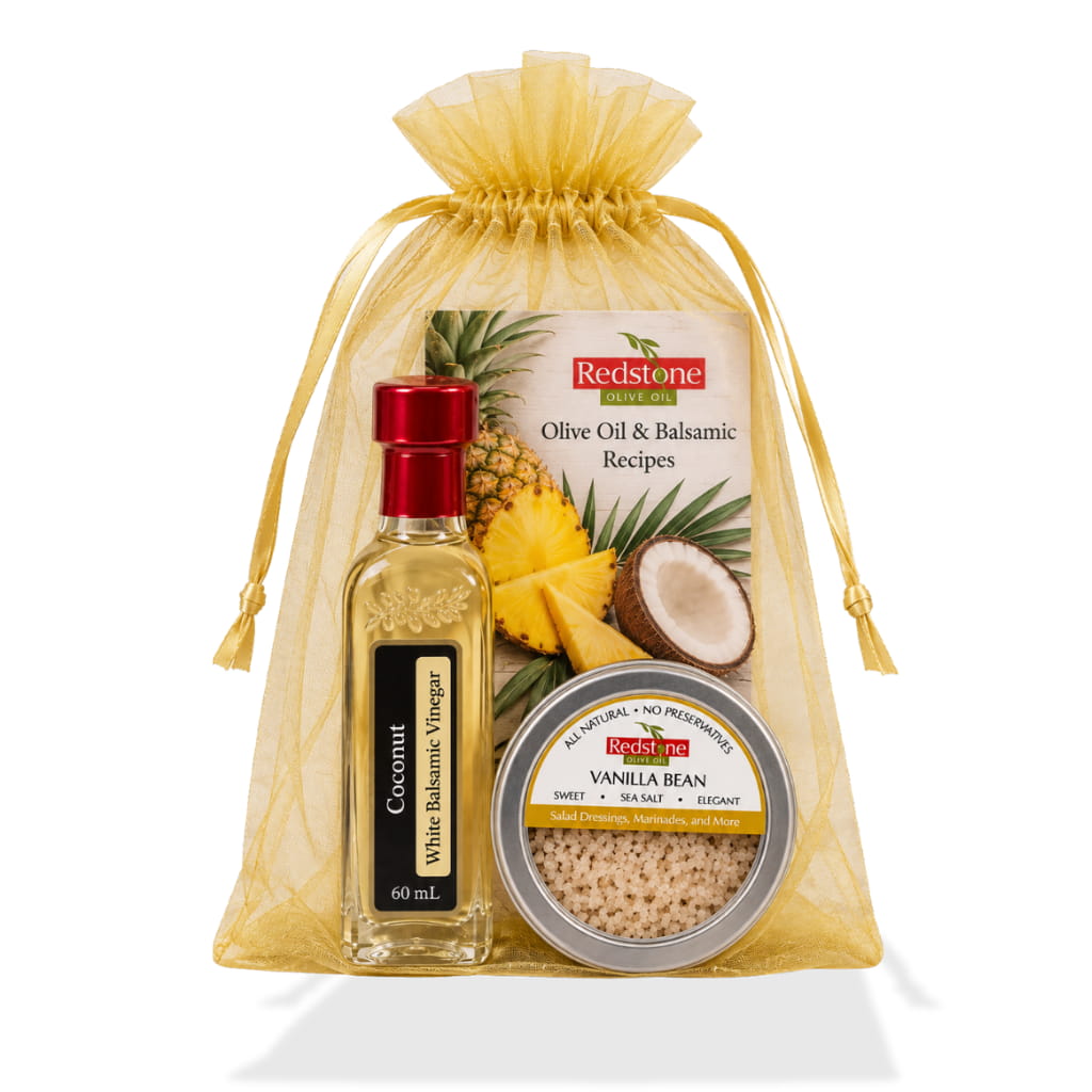 Coconut white balsamic 60 mL, Vanilla Bean Sea Salt tin, and recipe card in a gold organza gift bag