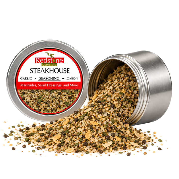 Redstone Steakhouse Spice Blend open tin spilling bold garlic onion pepper herb seasoning blend — all-natural, no preservatives