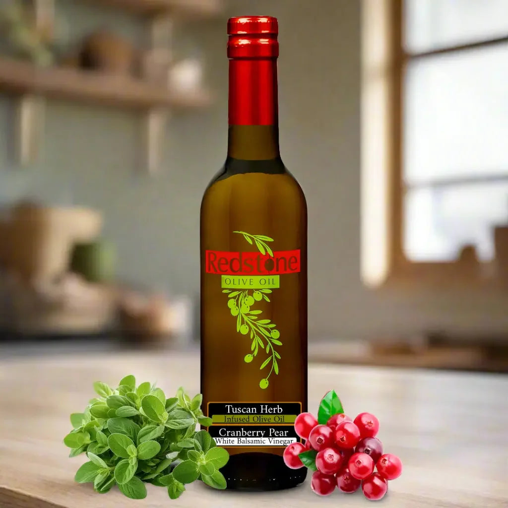 Tuscan Herb infused olive oil and Cranberry Pear white balsamic vinegar bottles on a kitchen counter