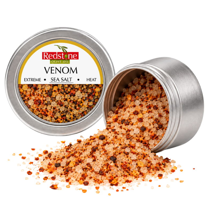Redstone Venom Sea Salt open tin spilling extreme heat multi-pepper sea salt crystals — all-natural gourmet finishing salt